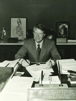 Photo of Jimmy Carter sitting at a desk